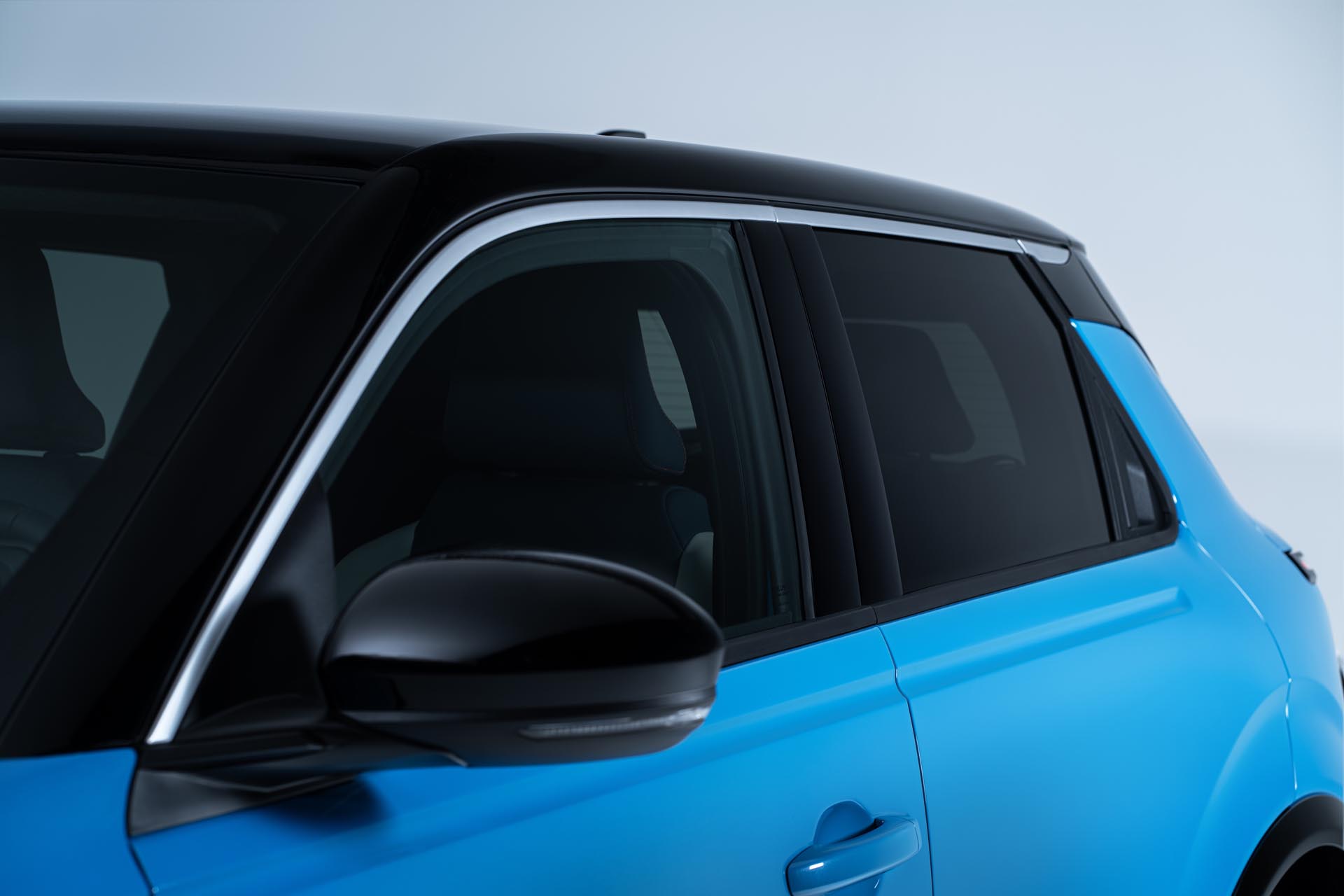 Side detailed view of Micra driver exterior door and passenger door with black roof and ice screen gelato scoop line on the side.