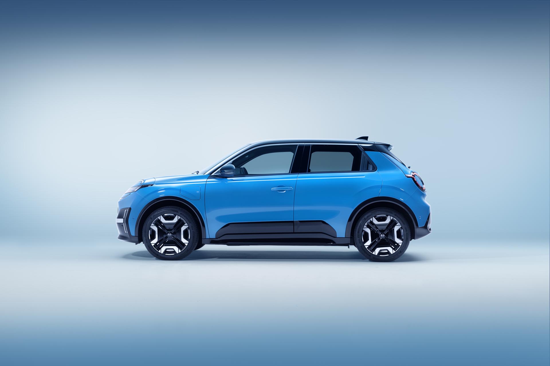 side profile view of All new Nissan Micra in gear blue body color and black roof